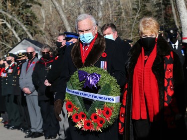 Murray McCann (L) and his wife Carol lay a wreath during Remembrance Day ceremonies at the Field of Crosses on Memorial Drive in northwest Calgary on Thursday, November 11, 2021. Jim Wells/Postmedia