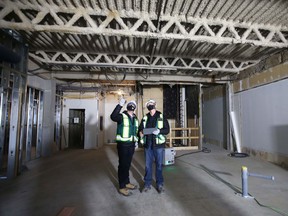 Construction workers inside Sierra Place, the former headquarters for Dome Petroleum which is being converted into affordable housing.