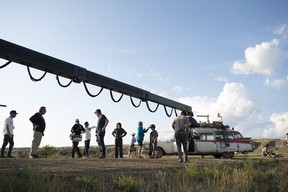 Ivan Reitman and Jason Reitman with crew and the Ecto-1 on the set of Columbia Pictures’ Ghostbusters: Afterlife. Photo by Kimberley French