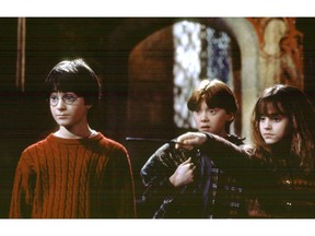 In 2001, Harry Potter and the Sorcerer's Stone, the first movie instalment of the best-selling series, opened in North America. It brought in a record $90 million its first weekend and eventually grossed $976 million worldwide.
Pictured are: Daniel Radcliffe, Rupert Grint and Emma Watson in a scene from Harry Potter and the Philosopher's Stone. Archives photo.