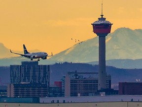 A WestJet Boeing 737 lands at the Calgary International Airport on Nov. 18, 2021.