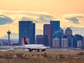 A Delta Airlines flight lands at the Calgary International Airport on Thursday, November 18, 2021.