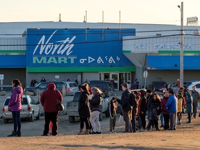 Hundreds of residents line up to collect bottled water after city officials in the northern territory said lab results confirmed that fuel had entered its water supply in Iqaluit, Nunavut, Canada on October 15, 2021.