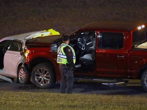 Calgary police investigate a crash which killed two people on Macleod Trail near Lake Fraser Gate S.E. on Nov. 24, 2021.