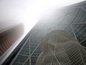 The Bow tower gets covered by heavy fog which blanketed Calgary on Monday, November 15, 2021.