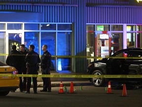 Calgary police investigate after a man was shot and killed in a parking lot at a strip mall on 28 St. and 2nd Ave. S.E. in Calgary on Monday, November 22, 2021.