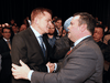 Brian Jean, left, shakes hands with Jason Kenney after it was announced that Kenney was elected leader of the new United Conservative Party, October 28, 2017.