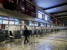 International check-in counters stand empty as several airlines stopped flying out of South Africa, amidst the spread of the Omicron variant, at O.R. Tambo International Airport in Johannesburg, South Africa, Nov. 28, 2021.