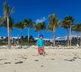 an image of a little boy on a beach in Cancun, Mexico