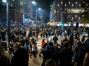 Demonstrators protest a partial coronavirus lockdown in the port city of Rotterdam on Friday, Nov. 19, 2021.