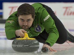 Matt Dunstone delivers a rock during the Tim Hortons Brier at WinSport Arena at Canada Olympic Park in Calgary on March 7, 2021.