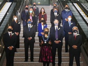 Calgary's new councillors and mayor celebrate their swearing in at city hall on Monday, October 25, 2021.