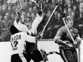 On this day in history in 1999, Team Canada of the 1972 Summit Series was named the greatest team of the century in The Canadian Press survey of Canada's sports journalists. Pictured, Yvon Cournoyer (12) of Team Canada hugs Paul Henderson after scoring the winning goal in the Canada-U.S.S.R. hockey series on Sept. 28, 1972. Archives photo.