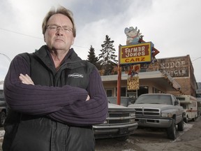 Ray Senecal, owner of Farmer Jones Carz, is seen standing outside his company's office in this January 26, 2012 file photo. Senecal was murdered in his apartment earlier this month.