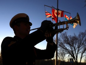 HMCS Calgary Master Seaman Jordan Shephard practises before the sunset ceremony during the Field of Crosses memorial along Memorial Drive in Calgary on Monday, Nov. 1, 2021.