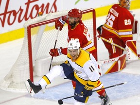 The Nashville Predators' Luke Kunin celebrates his first-period goal during NHL action at the Scotiabank Saddledome in Calgary on Tuesday night. The Predators won 3-2 in overtime.