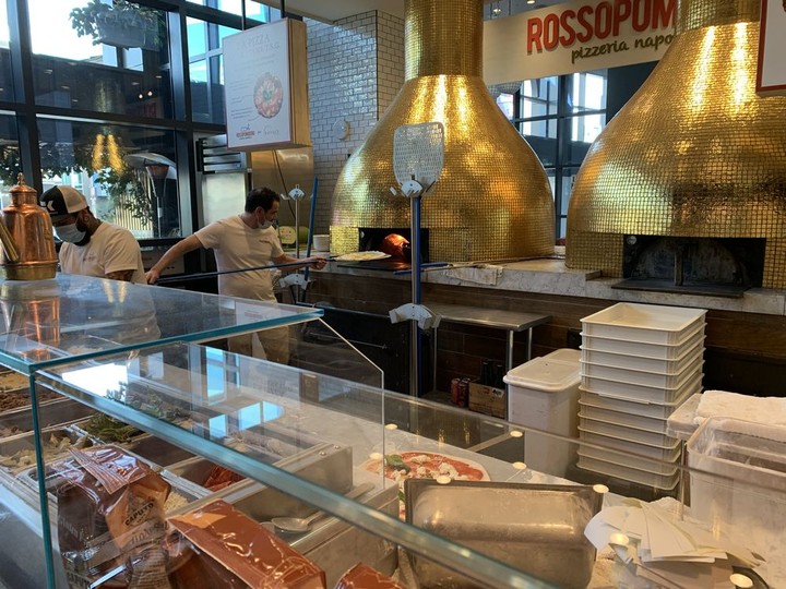  Pizza is being made in one of the ovens at Eataly food hall in Park MGM.