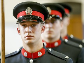 Newly minted Calgary Police Service constables stand at attention during graduating ceremonies at Mewata Armoury in Calgary on March 6, 2015.