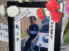 Family photo of a memorial for Mohamed Shaikh, 19, one of two men killed in a shooting in the community of Sandstone on August 28, 2020.