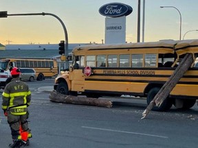 On Tuesday, just after 8:30 a.m. Barrhead RCMP responded to a collision between a school bus and semi-truck and trailer hauling logs.No one was injured after a log fell off a semi-truck and struck a school bus carrying children. Photo / Pembina Hills School Division