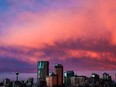 Clouds glow over the downtown Calgary skyline during sunrise on Wednesday, Nov. 3, 2021.
