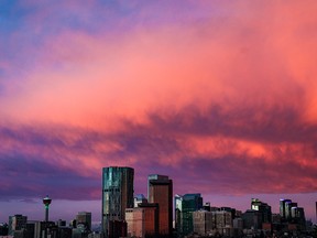 Clouds shine over the skyline of the City of Calgary during sunrise on Wednesday, November 3, 2021.