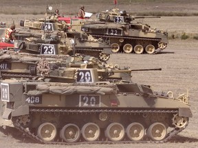 Armoured vehicles are shown during an exercise at CFB Suffield in 2001.