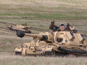 Two AS-90 self-propelled artillery pieces during Exercise Prairie Storm at CFB Suffield on May 19, 2017.