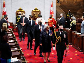 Governor General Mary Simon, her husband Whit Fraser and Prime Minister Justin Trudeau  leave after the Speech from the Throne in Ottawa on Tuesday, Nov. 23, 2021.