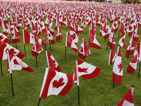 12,000 flags on the front lawn of the  Manulife building at 200 Bloor Street East, honouring members of the Canadian Armed Forces  on Thursday November 4, 2021.