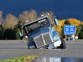 A truck is partially submerged on a flooded stretch of the Trans-Canada highway in Abbotsford, British Columbia, on Tuesday.