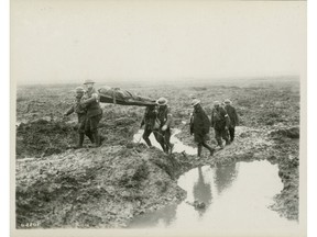 Wounded Canadian soldiers on their way to an aid post during the Battle of Passchendaele. Pte. Frederick Harvey fought and died in a nearby battle at Ypres. George Metcalf Archival Collection CWM 19930013-464} O.2201 © Canadian War Museum