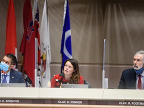 Councillors Evan Spencer, left, Kourtney Penner, and Richard Pootmans on Monday, December 20, 2021.