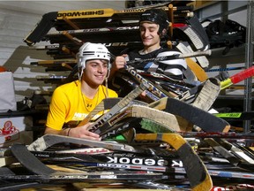 Ensuring Calgary children have a bright future is the focus of many of this year's Calgary Herald Christmas Fund agencies. Antonio Ferrise, left, and Mason Lilly from the U18AA Gold Calgary Northstars sort through sticks as they volunteer for KidSport Calgary in Calgary on Nov. 25, 2021.