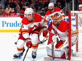 Calgary Flames defenceman Juuso Valimaki and goaltender Dan Vladar defend the net against the New Jersey Devils at the Prudential Center in Newark, N.J., on Oct. 26, 2021.