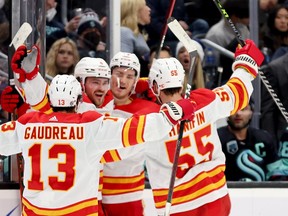 Matthew Tkachuk, of the Calgary Flames, celebrates his goal against the Kraken during third-period NHL action at Climate Pledge Arena on Thursday night in Seattle.