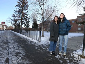 Livia Ion (L) and Emma Clark, both Grade 12 students, pose on 17 Ave SW near Western Canada High School in Calgary on Saturday, December 11, 2021.
