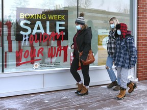 File photo: Customers brave the elements as they arrive at Calgary's Market Mall on Sunday, December 26, 2021.