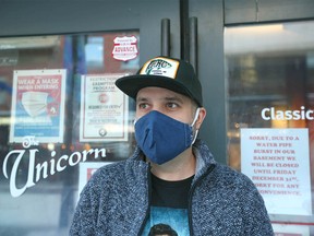 Kevin Warner, Assistant General Manager at the Unicorn Pub on Stephen Ave, Calgary, poses on Wednesday, December 29, 2021. A burst pipe at the popular pub during the recent cold snap forced the store to close.