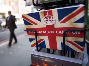 Postcards featuring the Second World War British slogan "Keep Calm and Carry On" are seen outside a newsagents in London, on June, 24, 2016.
