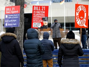 Calgarians gathered in front of city hall to protest against Quebec's Bill 21 in Calgary on Sunday, December 19, 2021.