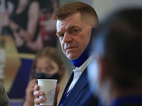 Brian Jean chats with fellow party members at the United Conservative Party AGM at the Grey Eagle Resort in Calgary on Saturday, November 20, 2021.