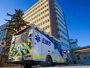 An ambulance waits outside the ambulance bay at the Foothills Medical Centre in Calgary on Monday, Dec. 6, 2021.