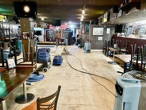 A supplied photo shows damage and cleanup work at the Unicorn Pub on Stephen Ave SW in downtown Calgary.  A pipe burst in the popular pub during the recent cold spell forced the store to close.