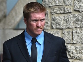 Edmonton Police Service Const. Michael Partington outside the Edmonton Law Courts on Aug. 26, 2021, after he was convicted of assaulting a suspect in 2019.