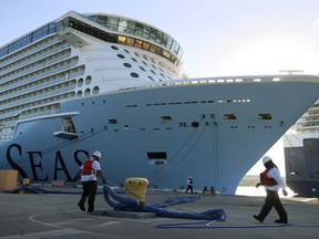 Royal Caribbean’s Odyssey of The Seas arrives to its berthing spot in Fort Lauderdale, Florida in June, 2021. The ship has been given a yellow flag for COVID outbreaks by the CDC. Photo by Joe Raedle/Getty Images