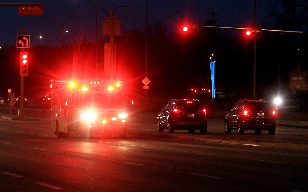  An ambulance responding to an emergency drives along 14th Street S.W. on Sunday, Nov. 28, 2021.