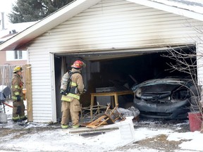 Calgary fire investigate a garage fire on Templeside Circle N.E. in Calgary on Saturday, December 4, 2021.