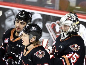 The Calgary Hitmen celebrate a 7-1 victory over the Moose Jaw Warriors on Thursday night at the Saddledome.