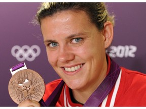 On this day in history in 2012, Christine Sinclair was named the winner of the 2012 Lou Marsh Award, becoming the first soccer player to take home the 76-year-old trophy named after the former Toronto Star sports editor. Here, Sinclair, the Captain of the women's soccer team, poses with her bronze medal during a  press conference at  the London 2012 Olympic games.  Friday August 10, 2012. AL CHAREST/CALGARY SUN/QMI AGENCY